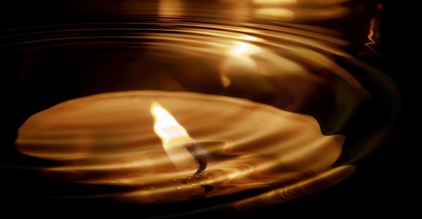 lit candles under water